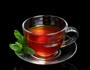 nice cup of tea and mint on black background