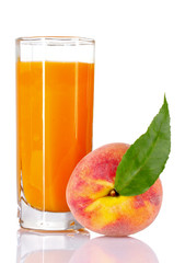 Fresh peaches and glass with juice isolated on white