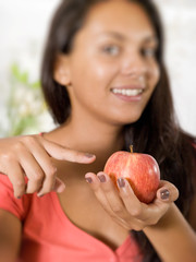 girl with red apple selective focus over apple