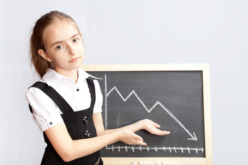 schoolgirl pointing to line graph