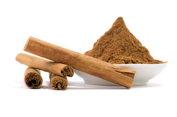 Cinnamon sticks and powder isolated on white background.