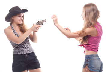 Portrait of two young girls with a gun