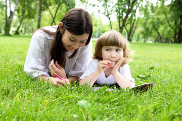 Portrait of mother with daughter outdoor
