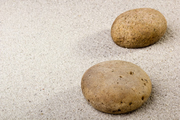 Fototapeta na wymiar Stone on the Sand