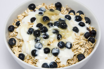 Bowl of muesli with yogurt and blueberries