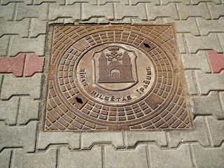 Lid of manhole with coat of arms