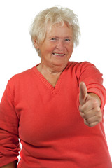 Happy senior woman make OK gesture on white background