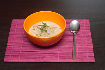 fresh lentil soup in an orange bowl