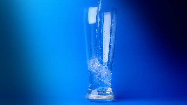 glass of water on a blue background