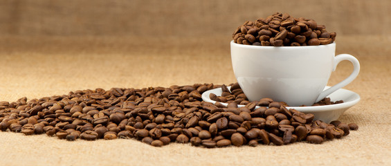White cup with coffee grains