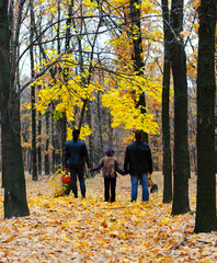 Family in autumn forest