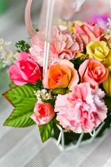 artificial flowers in basket