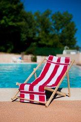 Beach chair near swimming pool