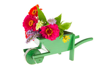 Green wheel barrow with flowers