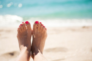 Girls feet in the sand