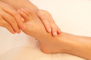 Obraz na płótnie Canvas reflexology foot massage, spa foot treatment,Thailand