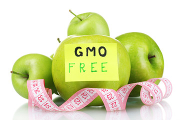 ripe green apples and measuring tape isolated on white