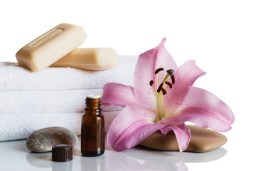 Essential oil, soap, lily, towels.