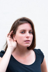 Relying on hand-ear listening woman