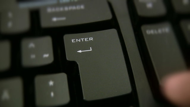 Finger pressing enter button 1