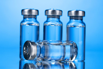 medical ampoules on blue background