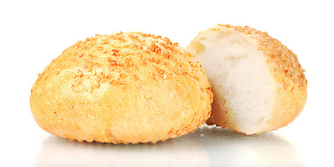 tasty sliced buns with sesame seeds isolated on white