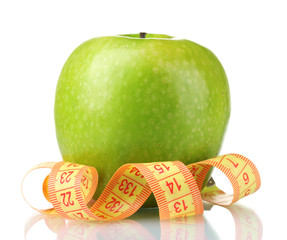 green apple and measuring tape isolated on white