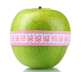 green apple and measuring tape isolated on white