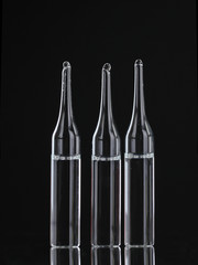 medical ampoules on black background