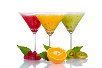 Delicious fruit smoothies and fruit isolated on white