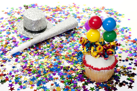 Cupcake, Confetti, Horn, and Hat at Party