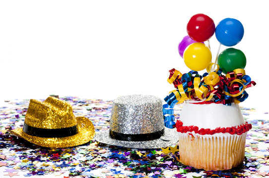 Cupcake, Hats, and Confetti at Party