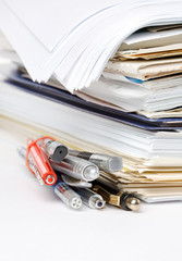 notebooks with paper and pencils