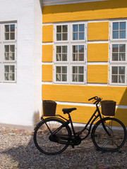 Fototapeta na wymiar Old retro bicycle parking by a wall