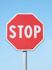 stop sign on blue sky background