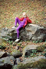 Naklejka na ściany i meble Portrait of Little Girl in Autumn Park