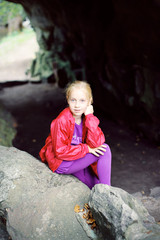 Fototapeta na wymiar Portrait of Little Girl in Autumn Park