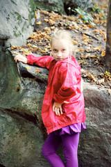 Portrait of Little Girl in Autumn Park