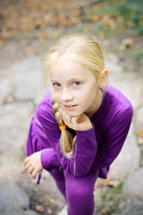 Portrait of Little Girl in Autumn Park