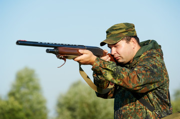 Fototapeta premium hunter with rifle gun