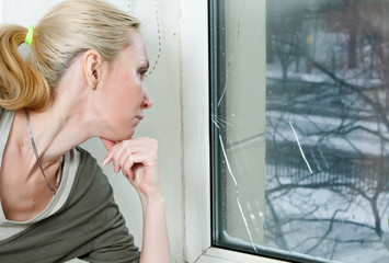 The housewife is upset, because the double-glazed window