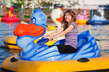 Teenage girl having fun in a water park