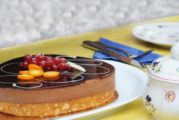 Chocolate cake covered with fruit , shallow dof
