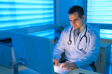Young doctors working in front of a computer