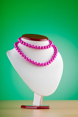 Stand with necklace in fashion concept