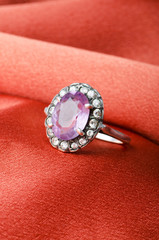 Fashion concept with ring on background