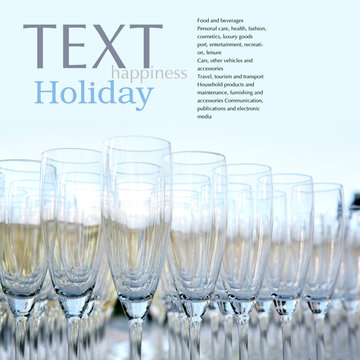 Beautiful champagne glasses over blurred background.Copy space
