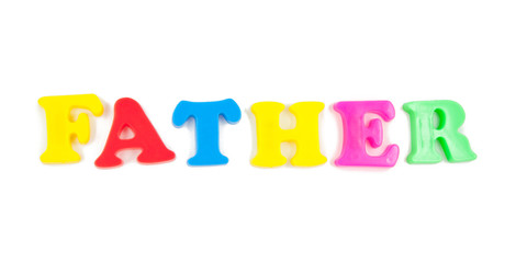 father written in child's fridge magnets on white