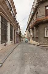 Fototapeta na wymiar Street with typical buildings in Old Havana