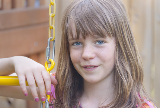 Young teenage girl on a swing